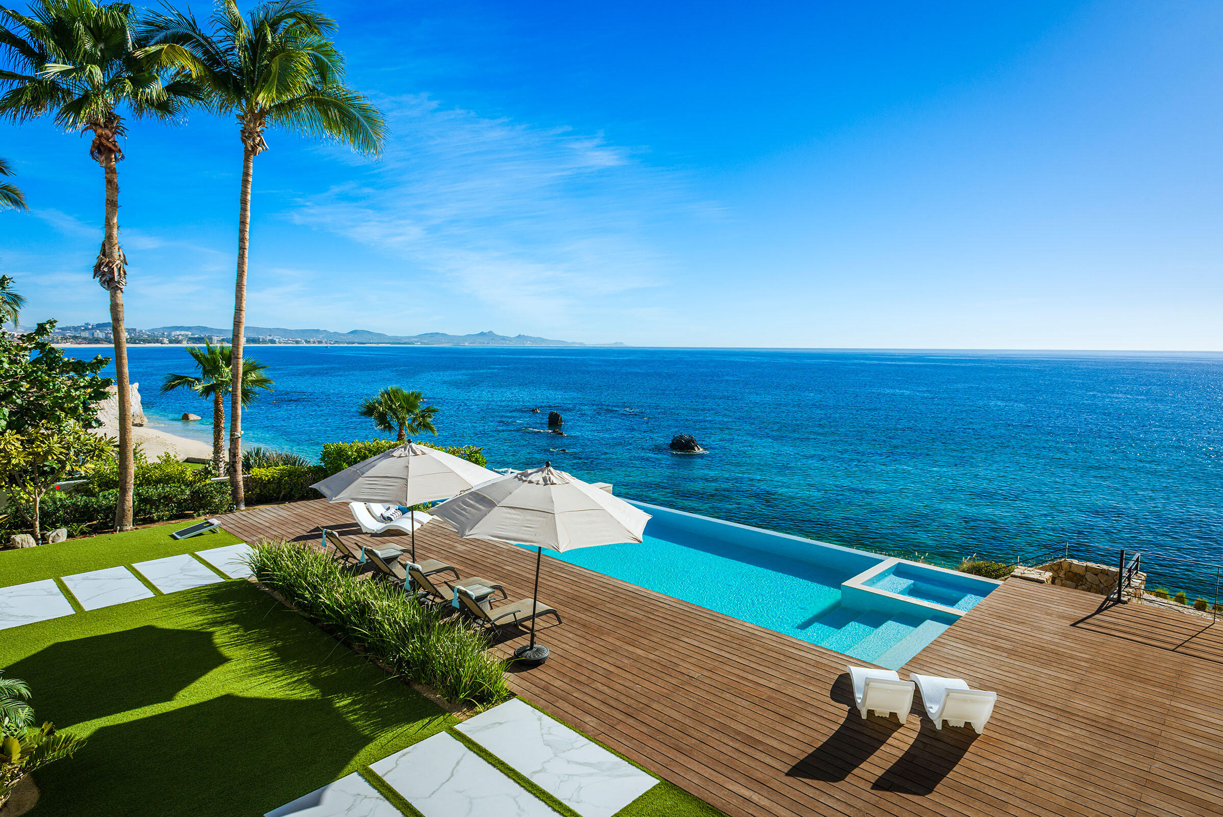 Cabo Luxury Las Terrazas Set along the 15th hole of the El Cardonal Golf Course, panoramic vistas extend from rolling fairways to the Pacific, delivering striking sunrises and sunsets.This four-bedroom, 4.5-bath home blends refined design with seamless indoor-outdoor living. Open-concept interiors feature Palecek furnishings, while each bathroom showcases hand-painted Mexican tile for warmth and authenticity.Outdoor living includes a private pool and elevated hot tub, outdoor grill and wet bar, lush landscaping, and expansive terraces with golf course and ocean for sale