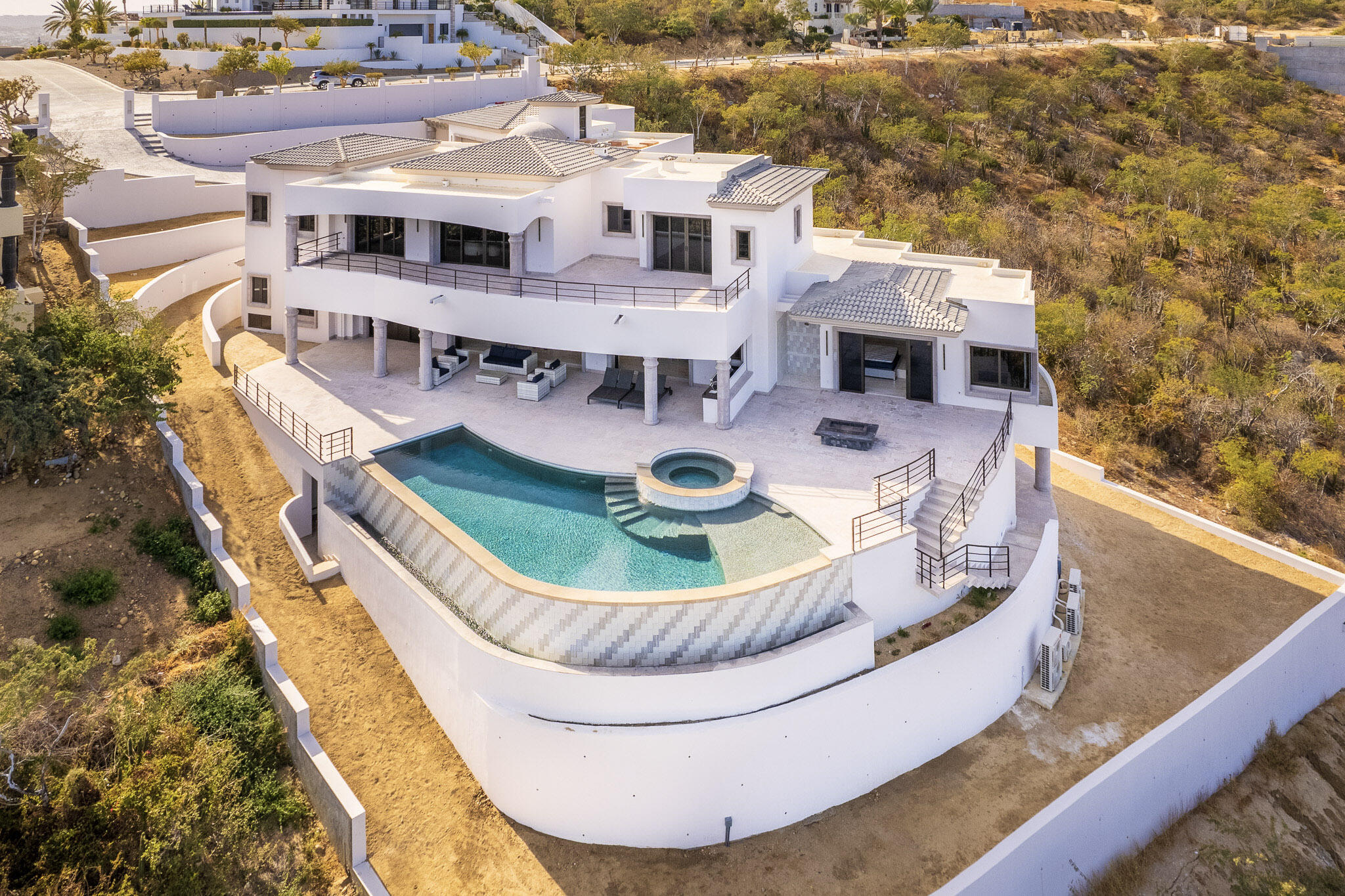 Cabo Luxury Sunset Hill Setting a new benchmark for modern design at Diamante, this truly exceptional five-bedroom, five-bathroom residence embodies the pinnacle of contemporary luxury. With an elevated aesthetic, the home utilizes state-of-the-art 3D foam panel construction to ensure remarkable environmental comfort, structural durability, and minimal long-term maintenance. Outfitted with a professional-grade suite of Wolf, Sub-Zero, and Zephyr appliances, the interior is a fully realized, turn-key masterpiece offering immediate access to the exclusive Diamante lifestyle. The open-concept living spaces are defined by a seamless indoor-outdoor flow, drawing the eye toward breathtaking sunset for sale