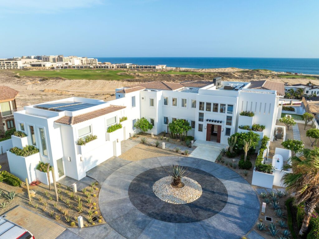 Cabo Luxury Beach Estates Luz de Diamante is perfectly situated just a short walk from the beach and nestled within the prestigious Diamante community positioned between the 5th and 16th holes of the Dunes Course designed by Davis Love III. Spanning approximately 20,000 sqft, this magnificent residence, built in 2017, seamlessly blends modern design with Mexican accents. The estate boasts four spacious master bedrooms, each providing stunning ocean for sale