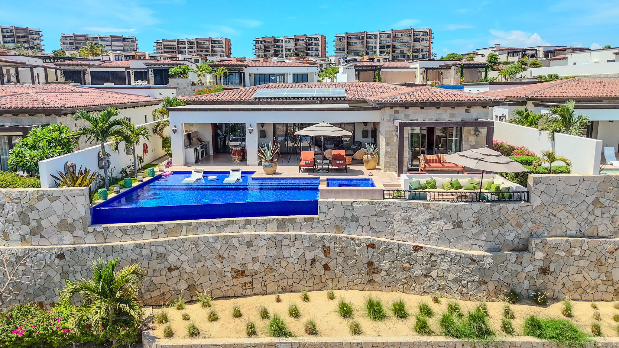 Cabo Luxury Sunset Hill Setting a new benchmark for modern design at Diamante, this truly exceptional five-bedroom, five-bathroom residence embodies the pinnacle of contemporary luxury. With an elevated aesthetic, the home utilizes state-of-the-art 3D foam panel construction to ensure remarkable environmental comfort, structural durability, and minimal long-term maintenance. Outfitted with a professional-grade suite of Wolf, Sub-Zero, and Zephyr appliances, the interior is a fully realized, turn-key masterpiece offering immediate access to the exclusive Diamante lifestyle. The open-concept living spaces are defined by a seamless indoor-outdoor flow, drawing the eye toward breathtaking sunset for sale