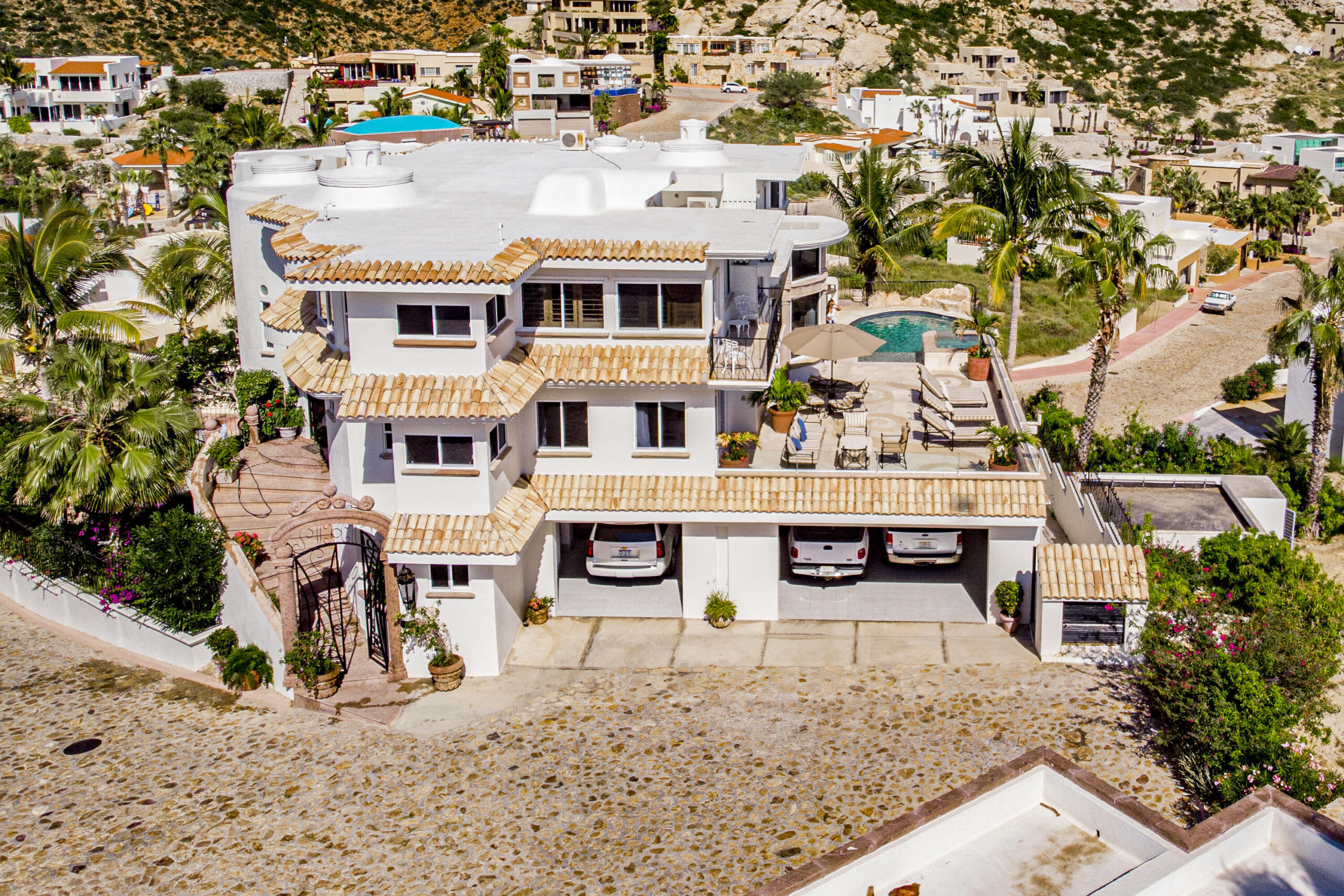 Cabo Luxury Las Terrazas Set along the 15th hole of the El Cardonal Golf Course, panoramic vistas extend from rolling fairways to the Pacific, delivering striking sunrises and sunsets.This four-bedroom, 4.5-bath home blends refined design with seamless indoor-outdoor living. Open-concept interiors feature Palecek furnishings, while each bathroom showcases hand-painted Mexican tile for warmth and authenticity.Outdoor living includes a private pool and elevated hot tub, outdoor grill and wet bar, lush landscaping, and expansive terraces with golf course and ocean for sale