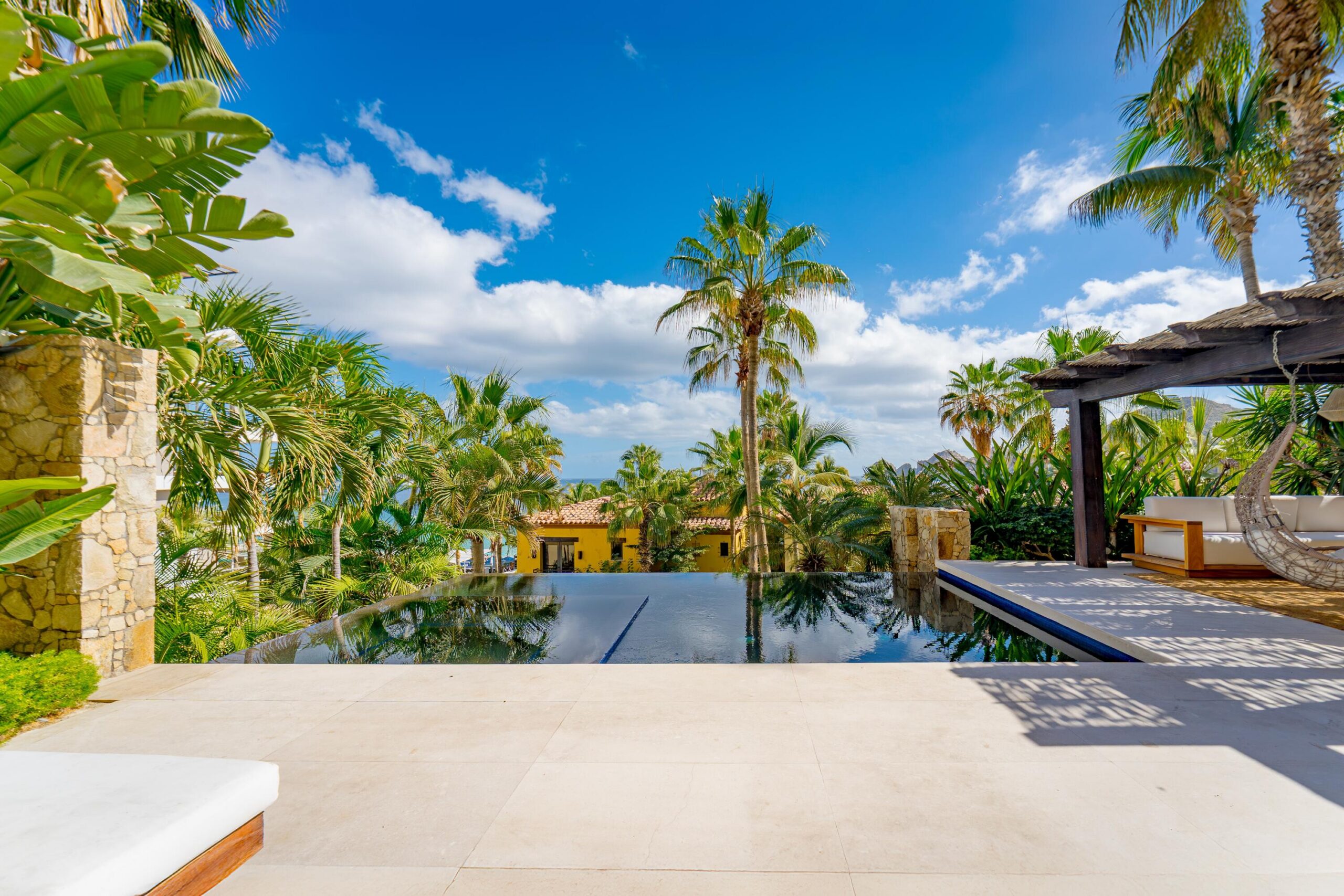Cabo Luxury Hacienda Csl This fully renovated three-bedroom property offers a seamless indoor-outdoor layout designed for comfortable coastal living.The private terrace features a pool, hot tub, BBQ area, and a dedicated outdoor bar, complemented by a shaded lounge and seating area surrounded by mature landscaping, ideal for entertaining or everyday relaxation. The ground-level setting allows easy access to outdoor spaces while maintaining privacy. Inside, the residence has been completely updated with clean, modern finishes and a functional floor plan. Bedrooms are well sized and thoughtfully distributed for both owners and guests. The layout includes a family suite / additional sleeping space (bunk room or flex sleeping area), allowing accommodation for up to 8 guests, offering greater flexibility than the typical 3-bedroom layout designed for six.Set in one of the most desirable areas of Cabo San Lucas, the property enjoys direct beach access and close proximity to the marina, restaurants, and services, all within the Hacienda Beach Club community. for sale