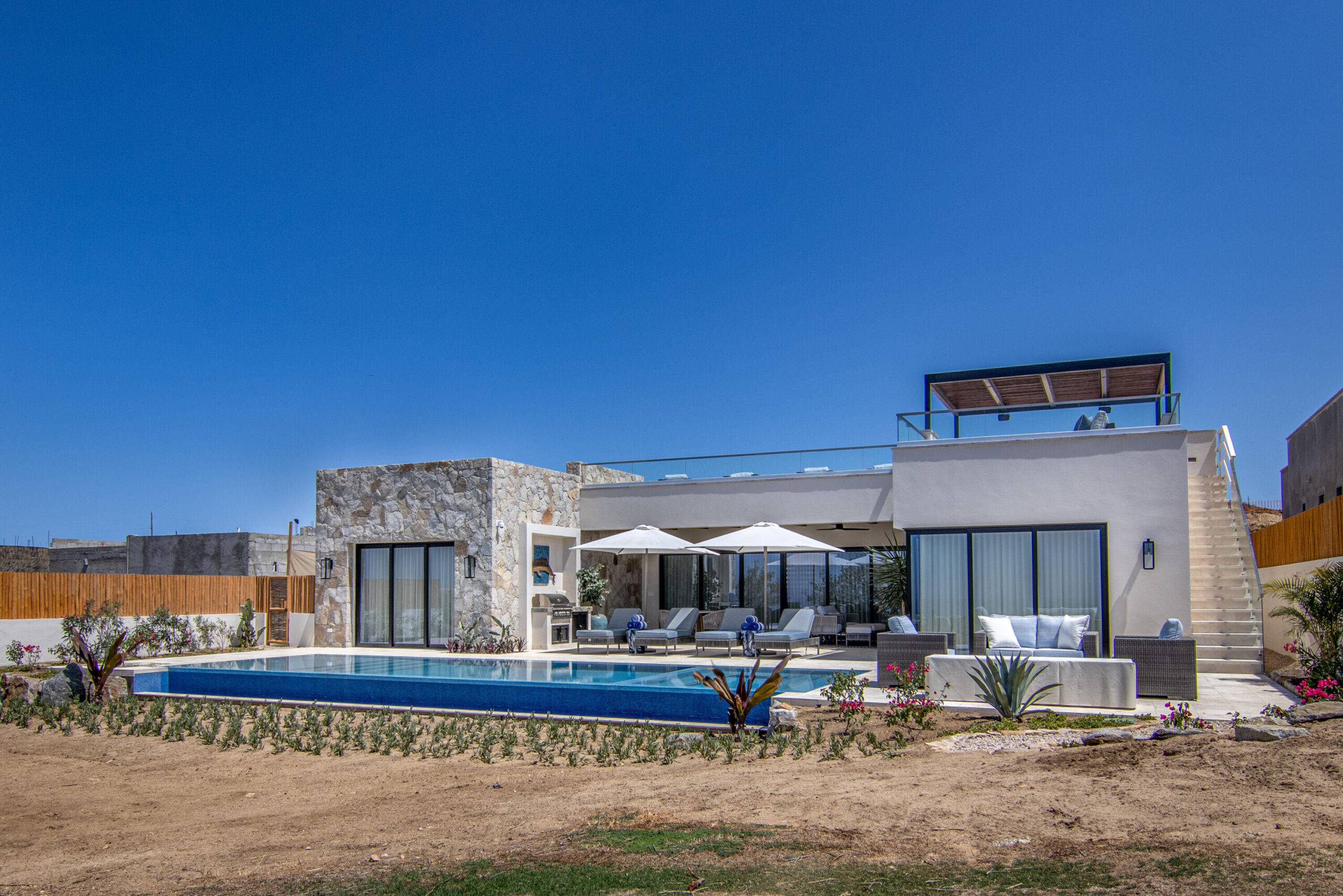Cabo Luxury Migaloo Designed with avant-garde Mexican architecture and infused with a boho-chic flair, Migaloo 6 is a three- story home crafted for seamless indoor-outdoor living. The top floor offers breathtaking panoramic for sale